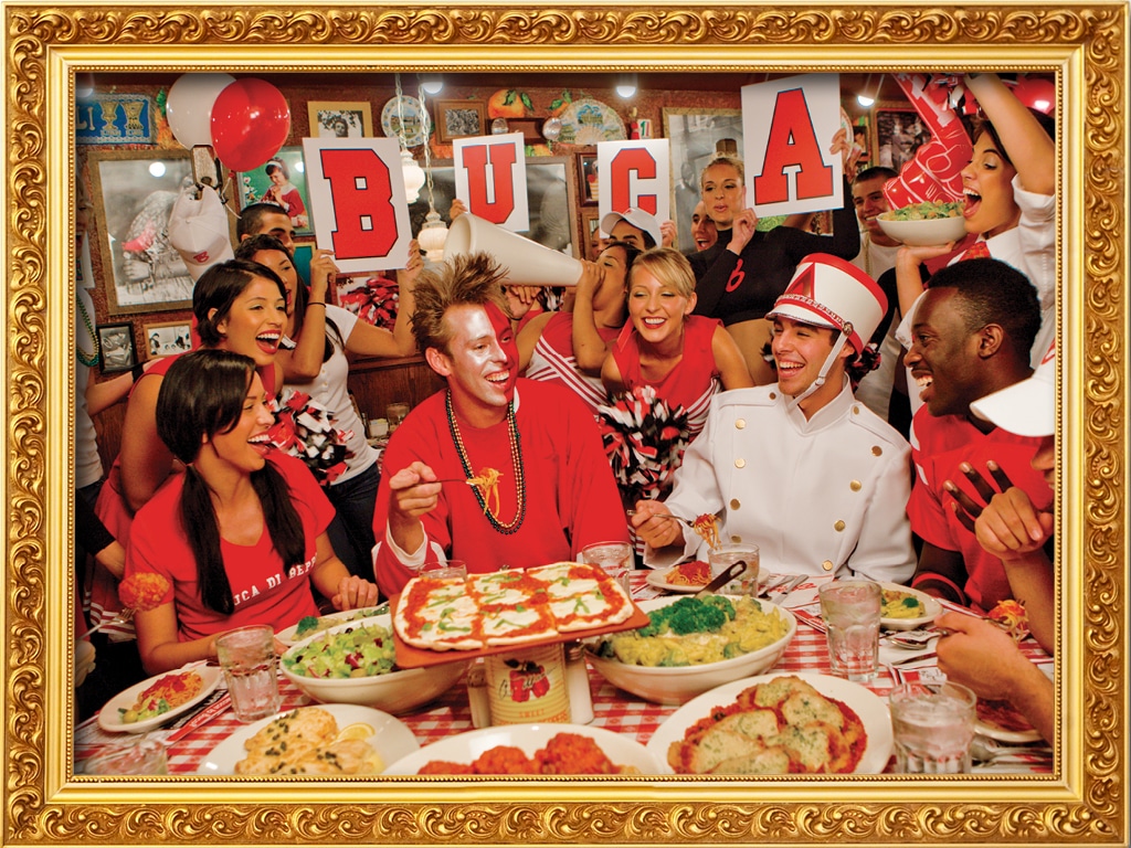 A group of sports fans celebrating at Buca