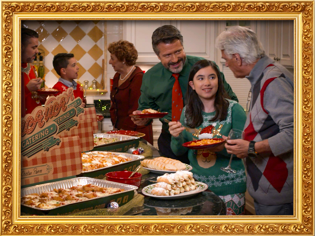 Holiday dinner at home with a family eating catering from Buca di Beppo