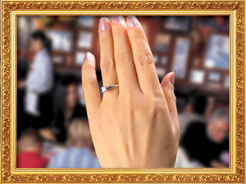 An image of an engagement ring on a hand at Buca di Beppo