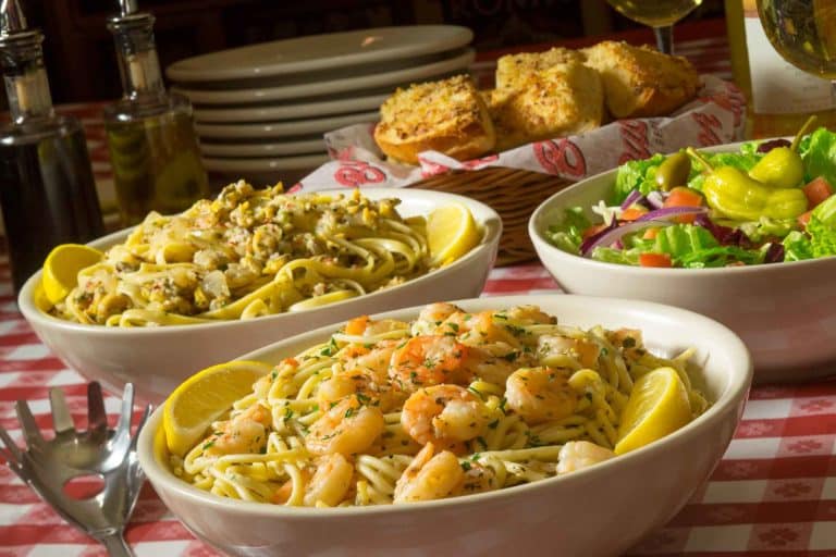A spread of Buca di Beppo's seasonal favorites like the Shrimp Scampi, Linguine & Clams, and our Salmon Pesto